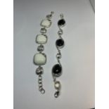 TWO MARKED SILVER BRACELETS ONE WITH BLACK STONES AND THE OTHER WITH WHITE