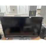 A TOSHIBA 42" TELEVISION WITH REMOTE CONTROL