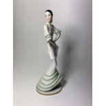 AN ART DECO PORCELAIN MODEL OF A DANCING LADY, POSSIBLY SAMPSON, IMPRESSED '566' MARK TO BASE