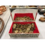 A DECORATIVE WHITE METAL BOX CONTAINING A LARGE QUANTITY OF THREE PENNY PIECES