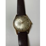 A VINTAGE 1960'S GENTS 9CT GOLD CASED 'CYMA' CYMAFLEX DATE WATCH