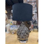 A MODERN WHITE METAL TABLE LAMP WITH 'ROSES' AND A BLACK SHADE