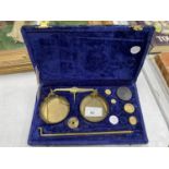 A VINTAGE SET OF BRASS GOLD SCALES IN BLUE CASE