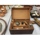 A WOODEN BOX AND CONTENTS TO INCLUDE TWO SILVER PLATED TOP BOTTLES