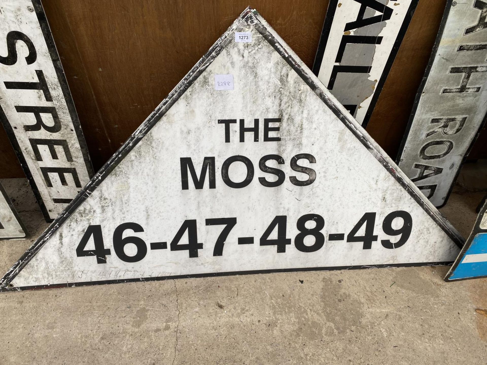 A VINTAGE TRIANGULAR METAL 'THE MOSS' ROAD SIGN