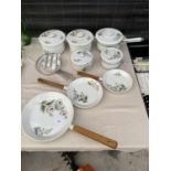 AN ASSORTMENT OF FLORAL PORCELAINE DE PARIS PANS TO INCLUDE THREE GRADUATED FRYING PANS AND FIVE