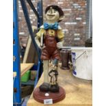 A LARGE RESIN FIGURE OF PINOCCHIO AND JIMINY CRICKET - HAT A/F HEIGHT 49CM