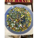 A LARGE BOWL CONTAINING A QUANTITY OF VINTAGE GLASS MARBLES