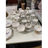 A LARGE QUANTITY OF CHINA CUPS, SAUCERS AND SIDE PLATES TO INCLUDE ROYAL ALBERT 'SILVER BIRCH',