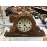 A LARGE VINTAGE MAHOGANY CASED NAPOLEON'S HAT SHAPED MANTLE CLOCK WITH BRASS PLATE STATING IT WAS