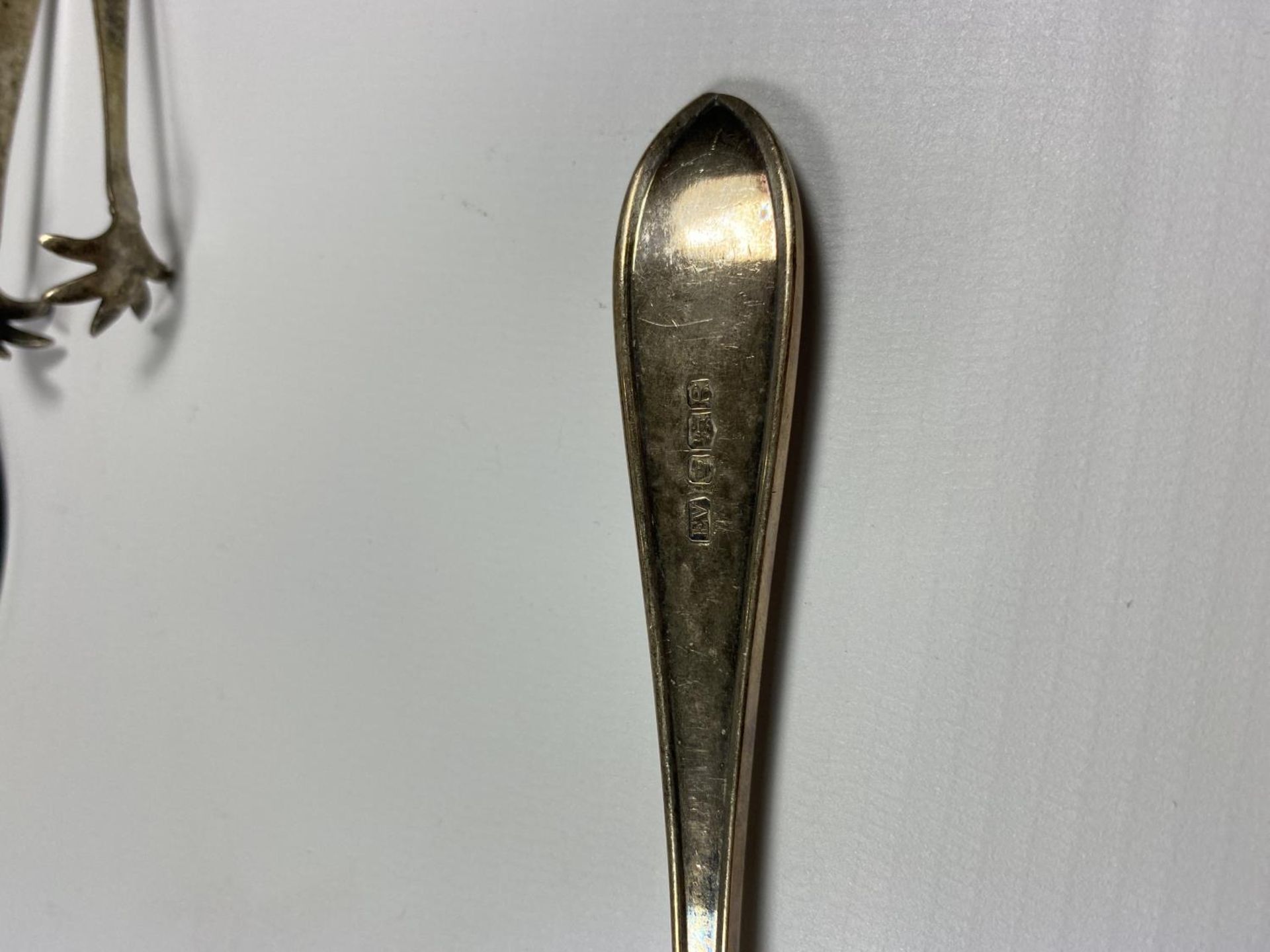 THREE HALLMARKED SILVER ITEMS - SMALL TROPHY ON BASE, TABLE SPOON AND SUGAR TONGS - Image 2 of 5