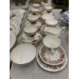 A QUANTITY PARAGON 'COUNTRY LANE' CUPS, SAUCERS AND SIDE PLATES PLUS PARAGON CUPS, SAUCERS, SIDE