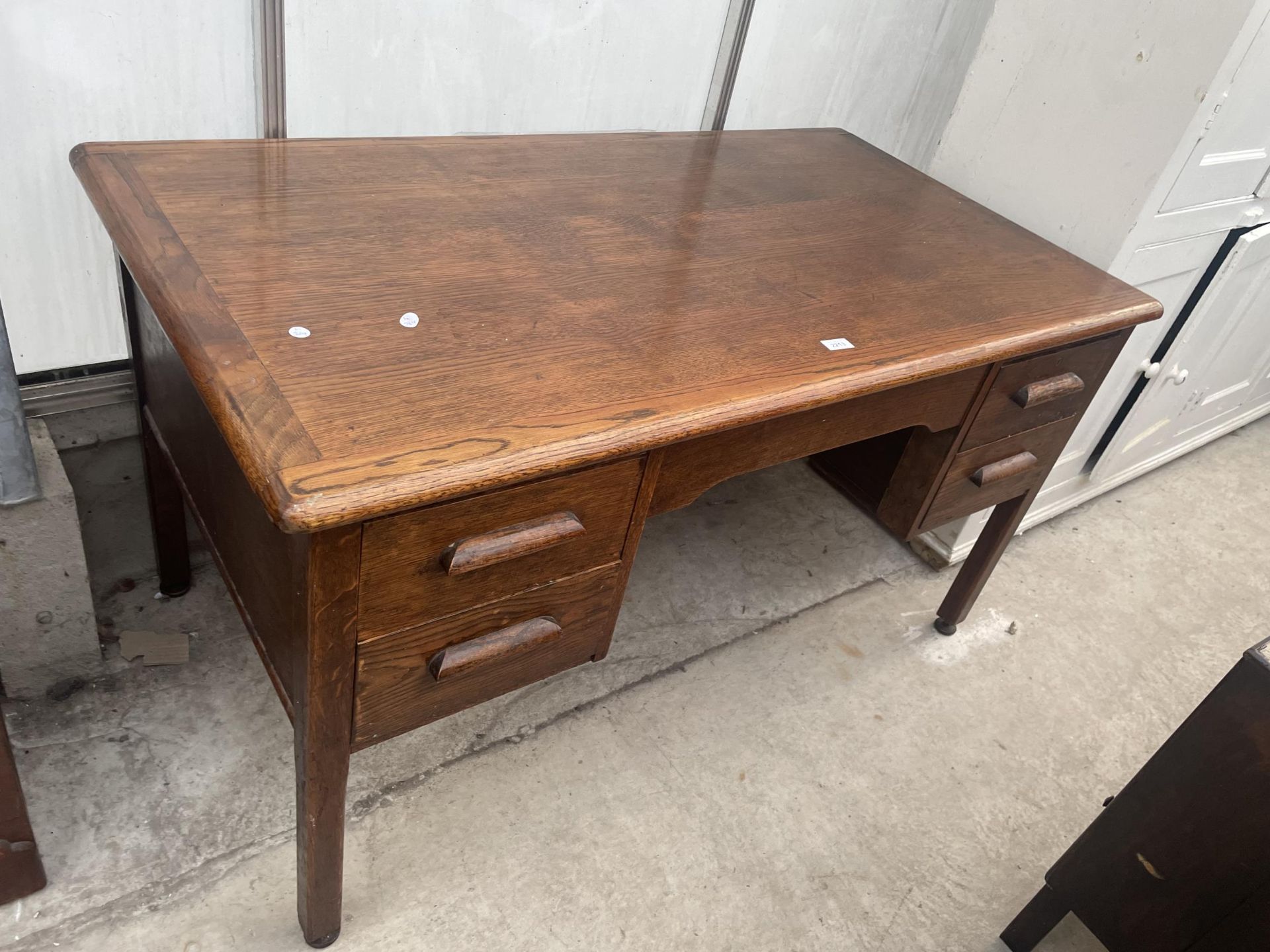 A MID 20TH CENTURY OAK 'ABBESS' TWIN PEDESTAL DESK, 54X30"