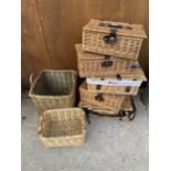 A LARGE ASSORTMENT OF WICKER ITEMS TO INCLUDE HAMPER BASKETS AND A SMALL LOG BASKET ETC