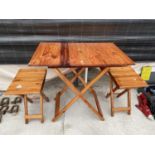 A WOODEN FOLDING TABLE AND CHAIRS