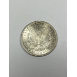 AN 1881 AMERICAN MORGAN ONE DOLLAR SILVER COIN IN BOX