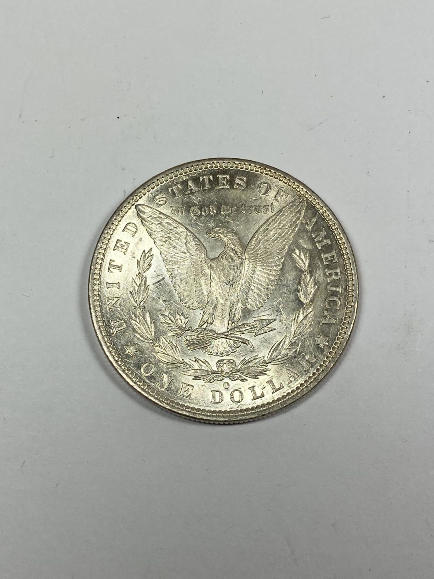 AN 1881 AMERICAN MORGAN ONE DOLLAR SILVER COIN IN BOX