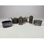 A HALLMARKED SILVER CONDIMENT SET COMPRISING MUSTARD POTS, OPEN SALT, SHAKERS AND FURTHER OPEN