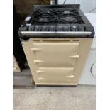 A CREAM AND BLACK AGA 60 DUEL FUEL OVEN AND HOB