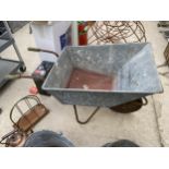 A VINTAGE GALVANISED WHEELBARROW