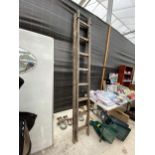 A VINTAGE TWO SECTION WOODEN 16 RUNG EXTENDABLE LADDER