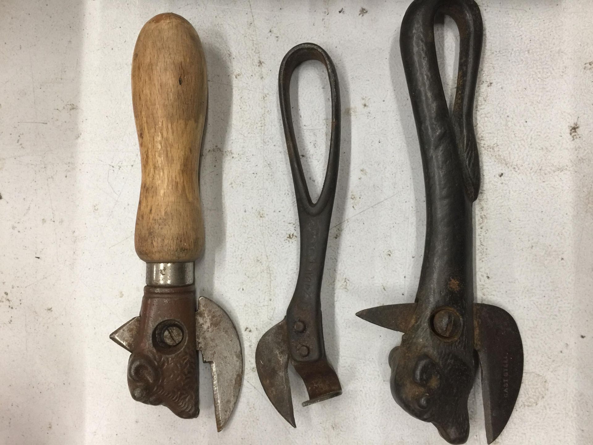 THREE VINTAGE CAN OPENERS TO INCLUDE TWO WITH BULLS HEADS
