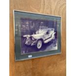 A FRAMED PRINT OF A VINTAGE ROLLS ROYCE 'THE SILVER GHOST'