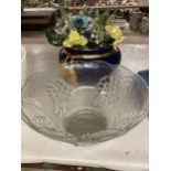 A LARGE GLASS BOWL WITH GRAPE AND VINE DECORATION AND A PLANTER CONTAINING DRIED FLOWERS