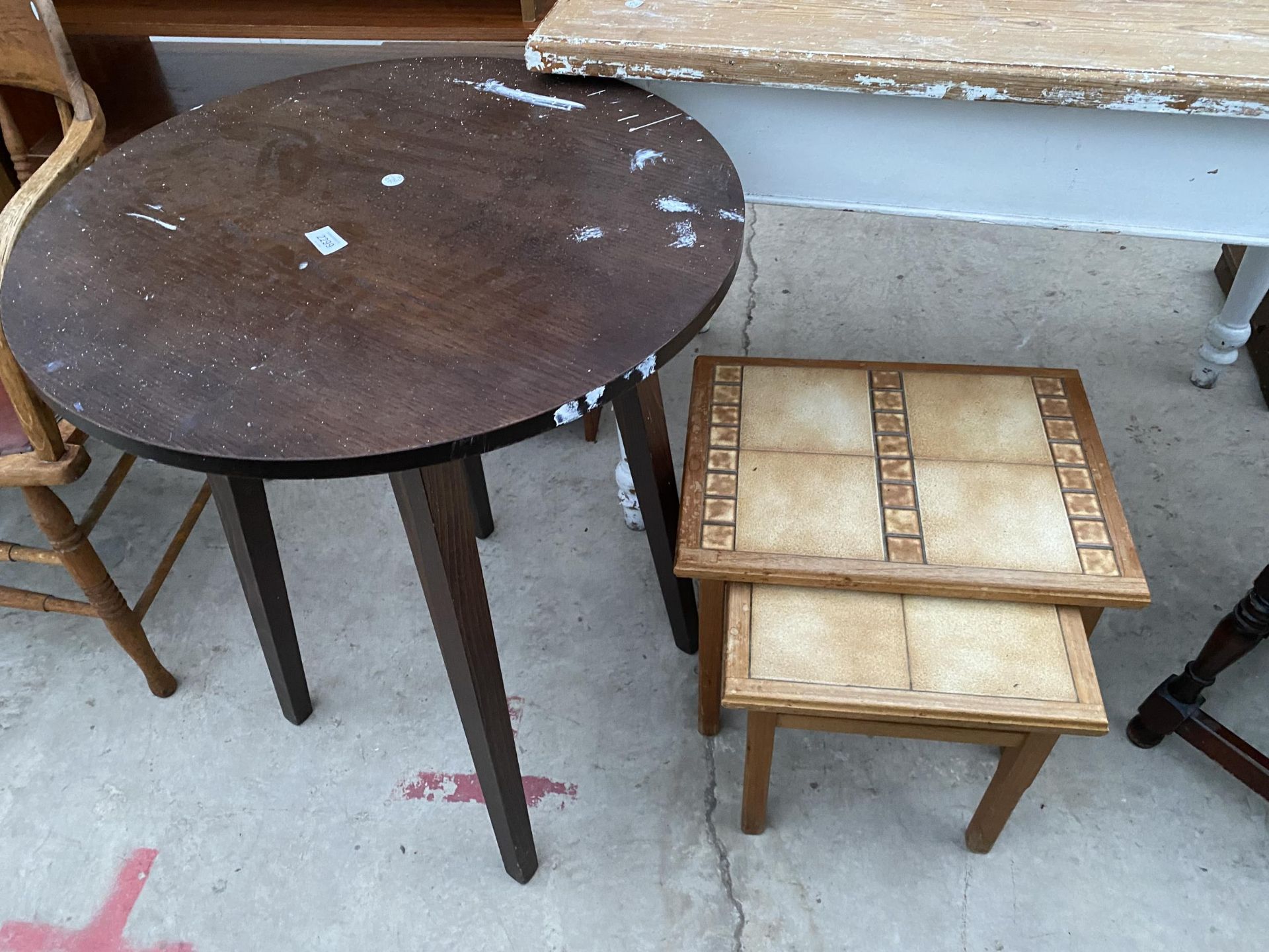 A PUB TABLE AND NEST OF TWO TABLES