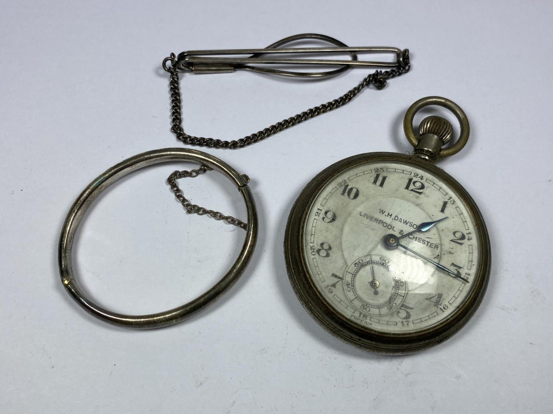 THREE ITEMS - A W.H DAWSON POCKET WATCH, HALLMARKED SILVER BANGLE AND FURTHER TIE CLIP