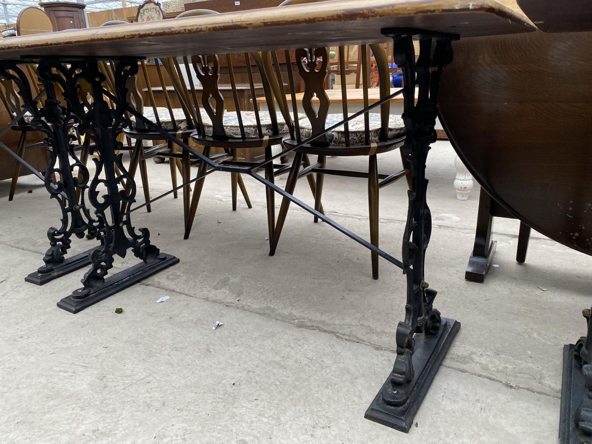 A PUB TABLE ON CAST IRON BASE, 48X27" - Image 2 of 4
