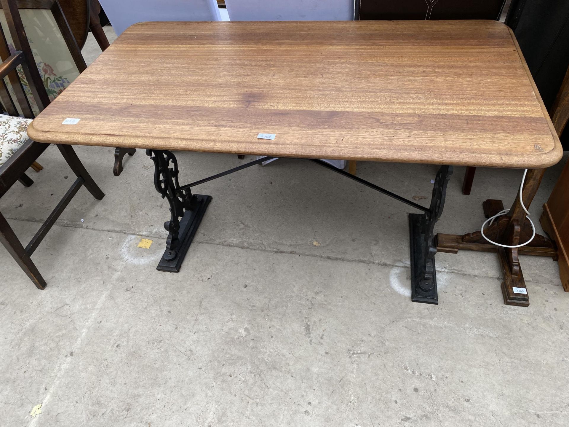 A PUB TABLE ON CAST IRON BASE, 48X27"