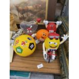 A COLLECTION OF M & M FIGURES AND FOOTBALL
