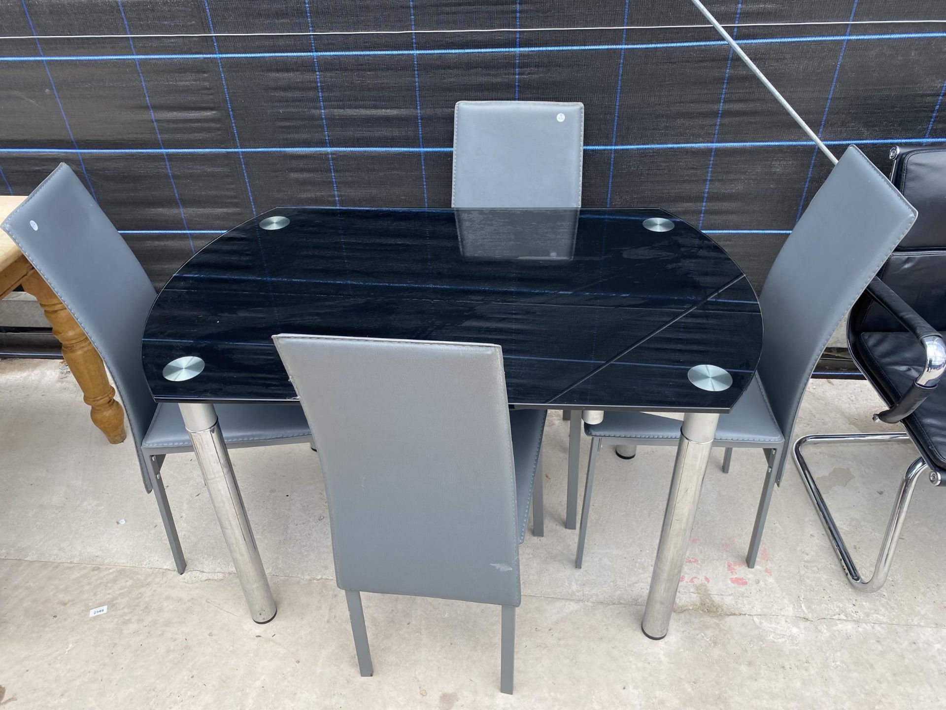 A MODERN GLASS TOP DINING TABLE AND FOUR CHAIRS WITH FOLDAWAY GLASS LEAVES