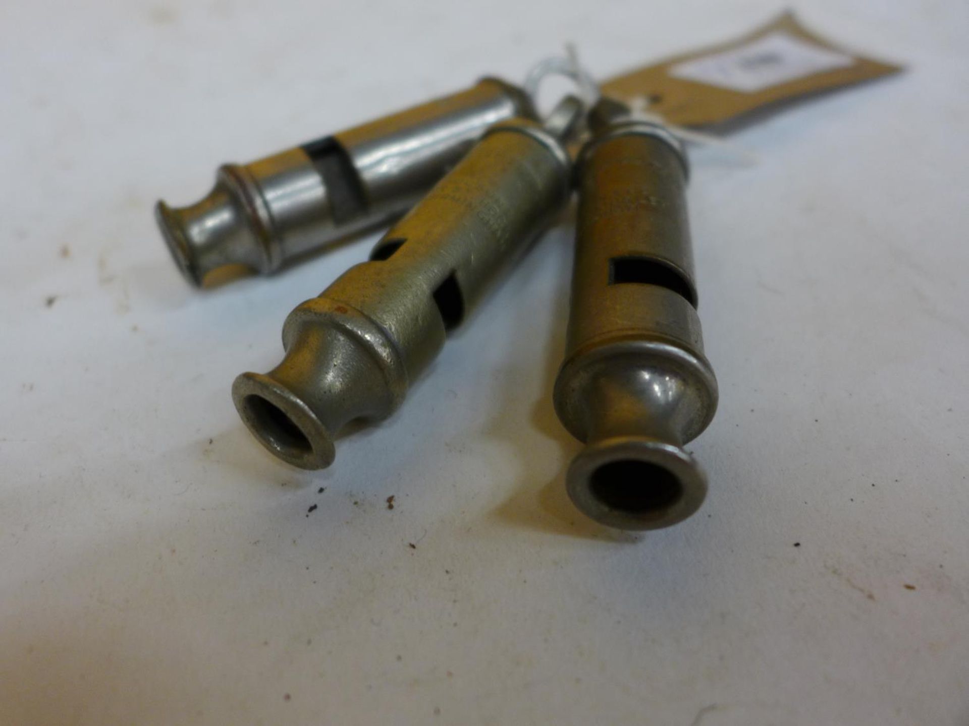 A J. HUDSON MILITARY WHISTLE DATED 1944 AND TWO METROPOLITON WHISTLES (3) - Image 2 of 2