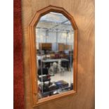 A PINE FRAMED ETCHED WALL MIRROR WITH ROS BUD DESIGN