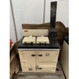 A CAST IRON CREAM AND BLACK RAYBURN ROYAL COOKER AND HOB