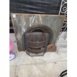 A VINTAGE CAST IRON FIRE PLACE WITH GRATE