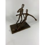 A BRONZE MODEL OF TWO FOOTBALLERS