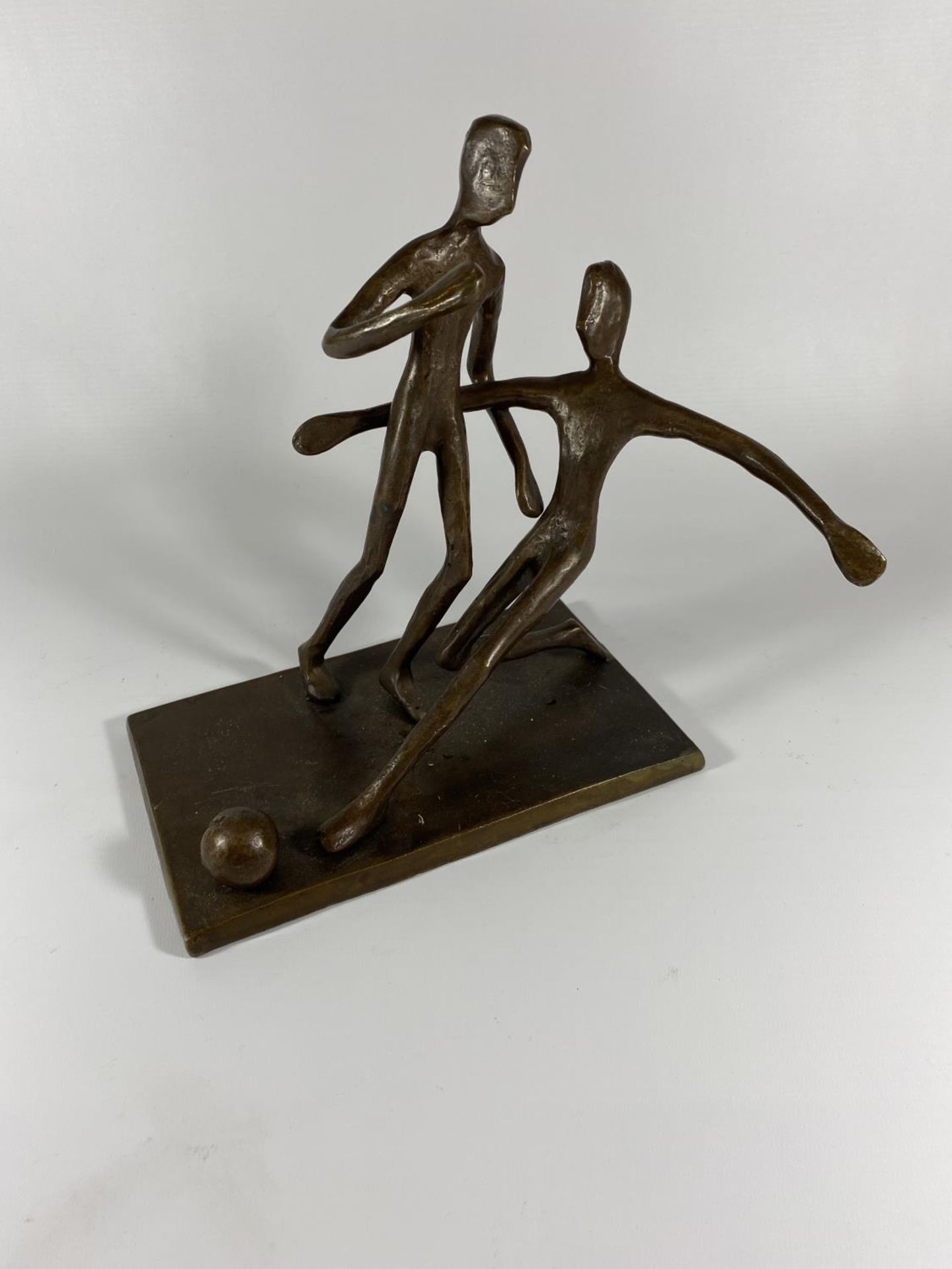 A BRONZE MODEL OF TWO FOOTBALLERS