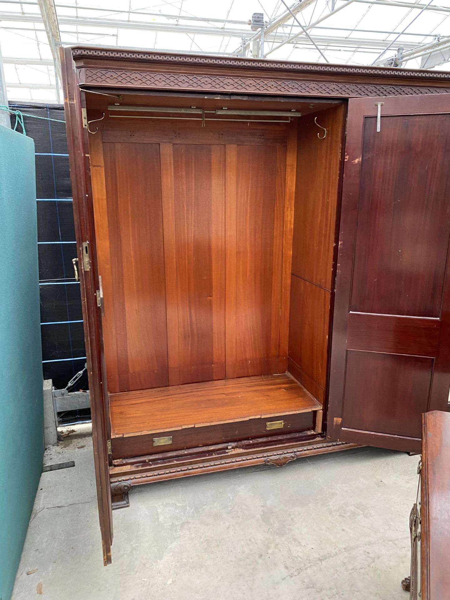 AN EDWARDIAN MAHOGANY 'CHIPPENDALE' STYLE TRIPLE WARDROBE ENCLOSING HANGING COMPARTMENTS, FIVE - Image 10 of 14