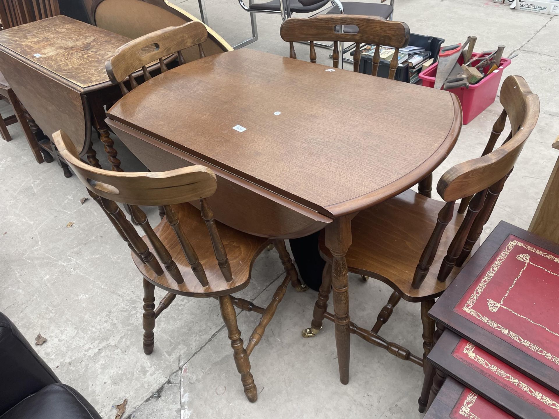 A MODERN OVAL DROP-LEAF DINING TABLE AND FOUR CHAIRS