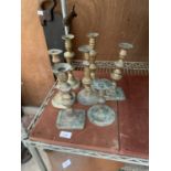 AN ASSORTMENT OF VINTAGE BRASS CANDLESTICKS