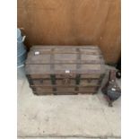 A VINTAGE WOODEN DOME TOPPED TRAVEL TRUNK WITH WOODEN BANDING AND METAL CLASPS