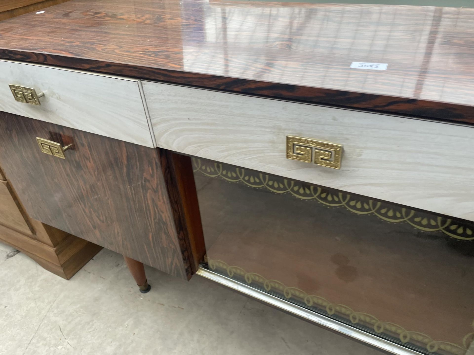 A MID 20TH CENTURY ROSEWOOD SIDEBOARD, 60" WIDE ENCLOSING THREE DRAWERS AND CUPBOARDS - Image 4 of 4