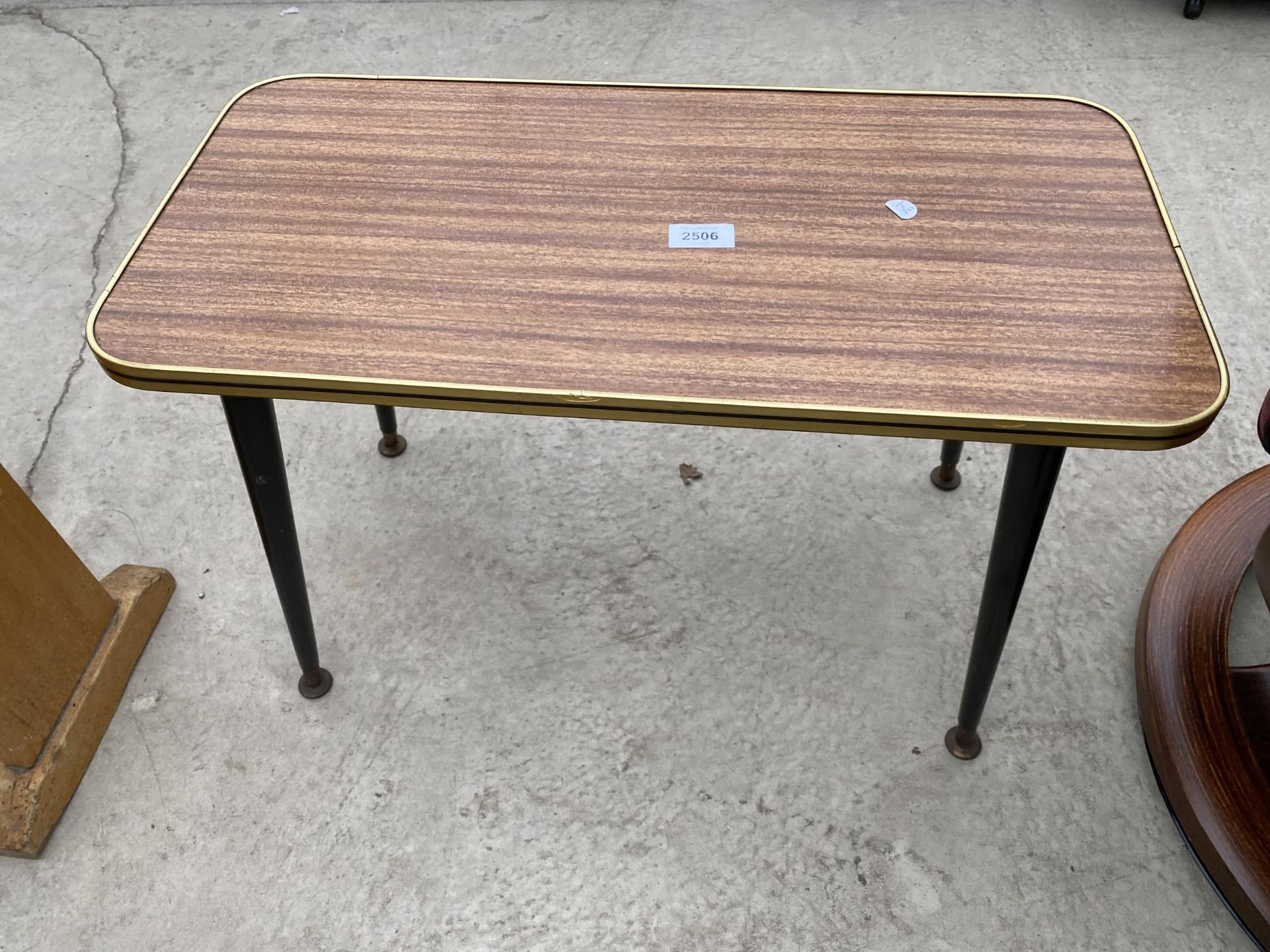 A 1950'S 'NEWISTE' COFFEE TABLE, 24X12"