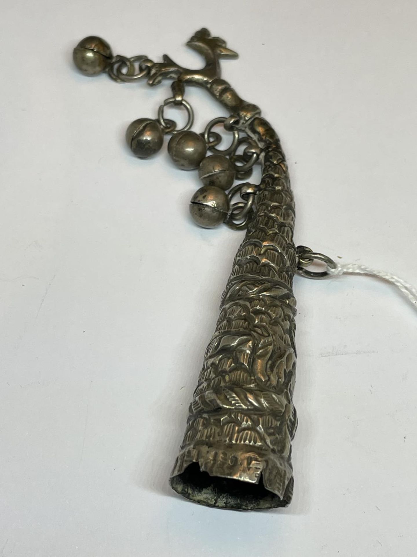 AN ASIAN SILVER RATTLE