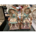 A PAIR OF BISQUE CONTINENTAL SEATED FIGURES