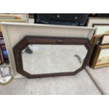 AN OAK FRAMED OCTAGONAL WALL MIRROR AND A FRAMED PRINT