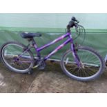 A GIRLS MAXIMA MOUNTAIN BIKE WITH A 18 SPEED GEAR SYSTEM